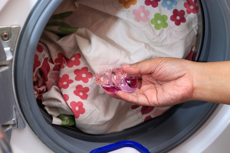 Putting laundry pods in washing machine