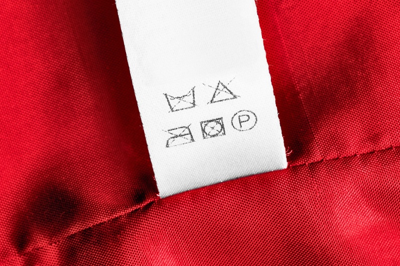 care label on red satin fabric