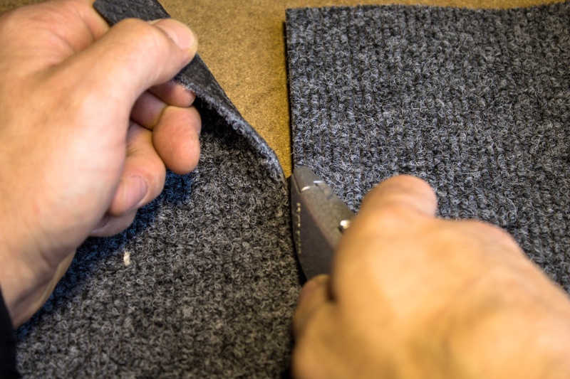 cutting a part of carpet