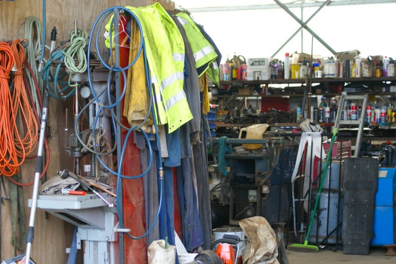 garage or workshop with working clothes and chemicals