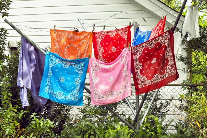 hanging bandanas on clothes line to dry