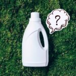 liquid laundry detergent on grass