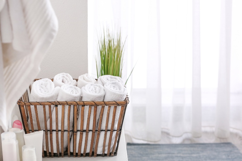 towels in basket inside bathroom