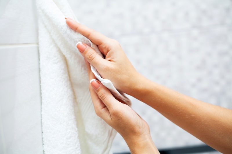 wiping hands with towel