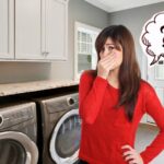 woman covers nose due to smelly laundry room