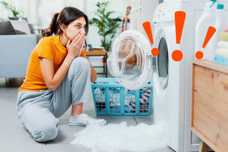 woman shocked with foam from washing machine