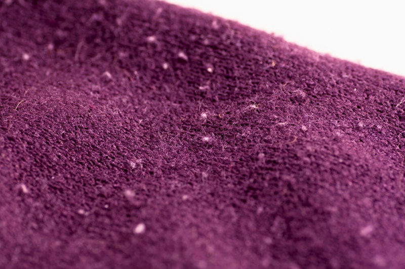 purple sweater with lint
