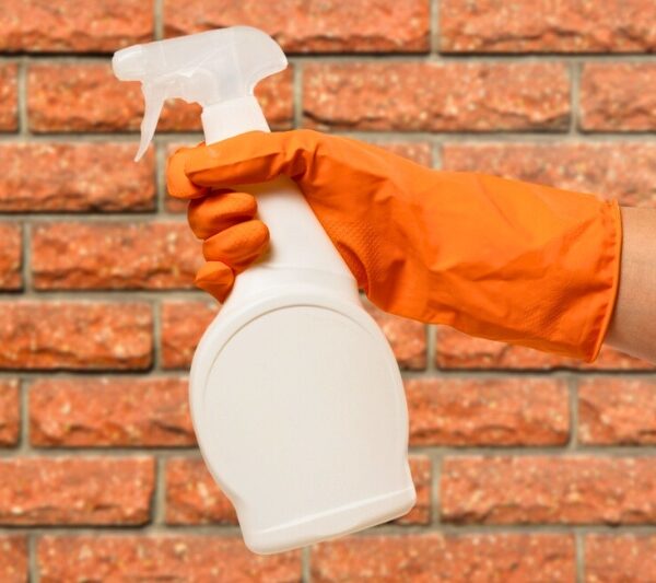 white bottle spray with brick wall background