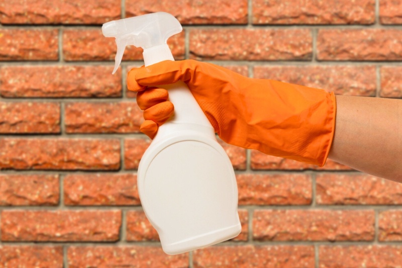 white bottle spray with brick wall background